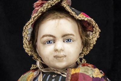 Lot 31 - An unusually large 19th century English poured wax shoulder-head child doll