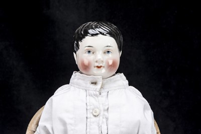 Lot 33 - A rare mid 19th century Kister china shoulder-head boy doll with jointed wooden body
