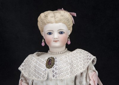 Lot 43 - A rare Simon & Halbig bisque swivel headed glass eyed moulded hair lady doll
