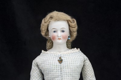 Lot 44 - An unusual German bisque shoulder-head doll with domed head and glass eyes