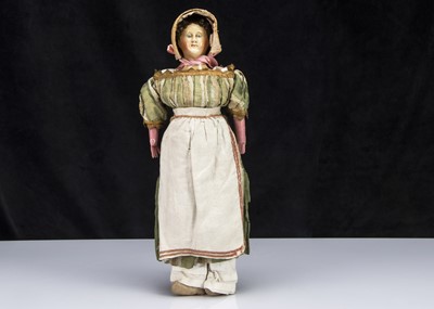 Lot 51 - A rare mid 19th century German papier-mache shoulder-head doll with elaborate hair and moulded comb