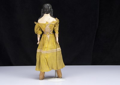 Lot 52 - A rare mid 19th century German papier-mache shoulder-head doll with elaborate hair