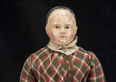 Lot 53 - A first half of the 19th century German papier-mache shoulder-head boy doll on French kid body