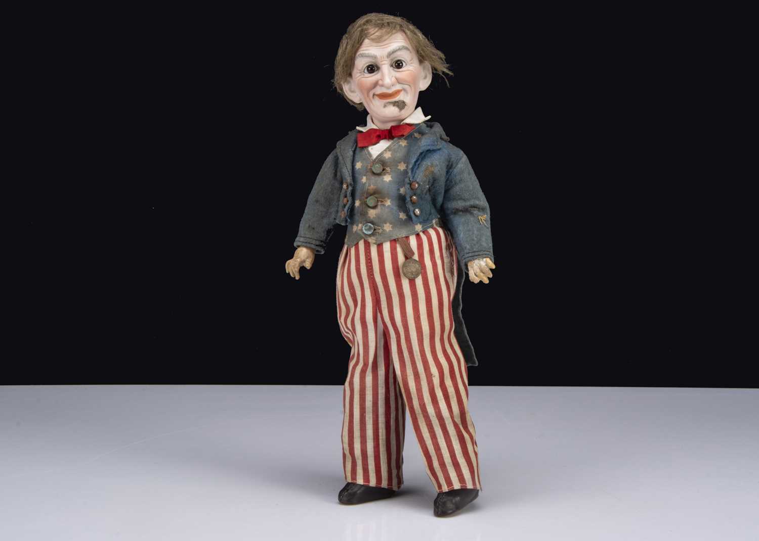 Lot 57 - A Cuno & Otto Dressel bisque headed Uncle Sam doll