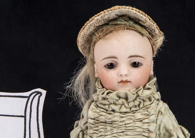 Lot 84 - A small all-bisque Simon & Halbig Mignonette swivel head child doll for the French market