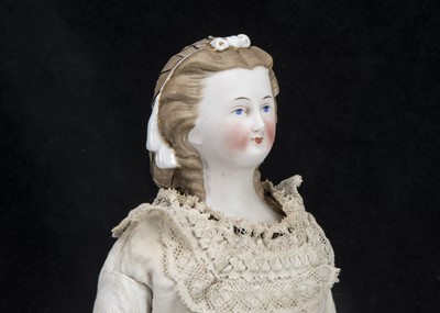 Lot 91 - A rare and fine German bisque shoulder-head doll with net snood