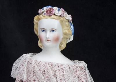 Lot 92 - A fine German bisque shoulder-head lady doll with flowers in hair