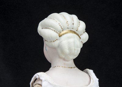 Lot 93 - A fine and rare German bisque shoulder-head doll with elaborate hair and moulded necklace