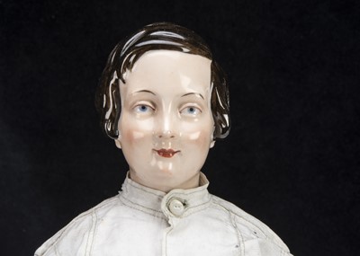 Lot 94 - A rare mid 19th century KPM pink tinted china shoulder-head boy doll