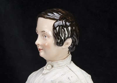 Lot 94 - A rare mid 19th century KPM pink tinted china shoulder-head boy doll