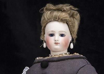 Lot 99 - A rare Pierre Victor Clement pressed bisque swivel head fashionable doll with jointed air-blown leather body