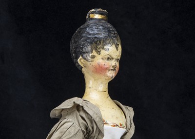 Lot 100 - A rare large Grodnerthal carved wooden doll with painted bodice trim 1820s