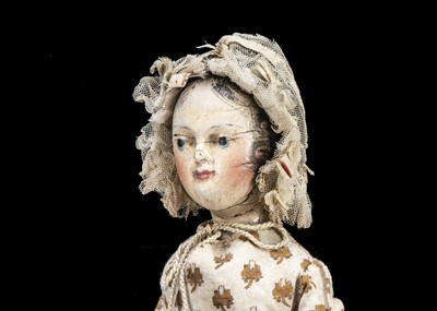 Lot 101 - An interesting early 19th century German carved and painted wooden doll