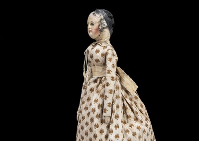 Lot 101 - An interesting early 19th century German carved and painted wooden doll