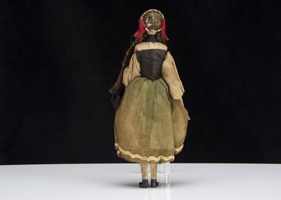 Lot 102 - A small 19th century German composition headed doll with jointed wooden body