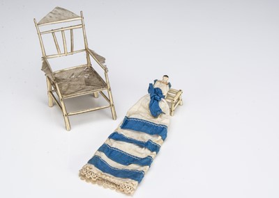 Lot 110 - A 19th century Grodnerthal dolls’ house baby in feather chair