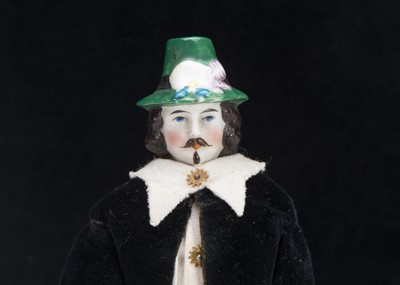 Lot 119 - A rare mid 19th century larger dolls’ house bisque shoulder head doll with moulded hat