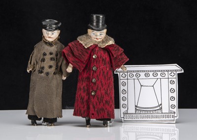 Lot 124 - Early 20th century bisque shoulder-head dolls’ house gentleman and his chauffeur with moulded hats