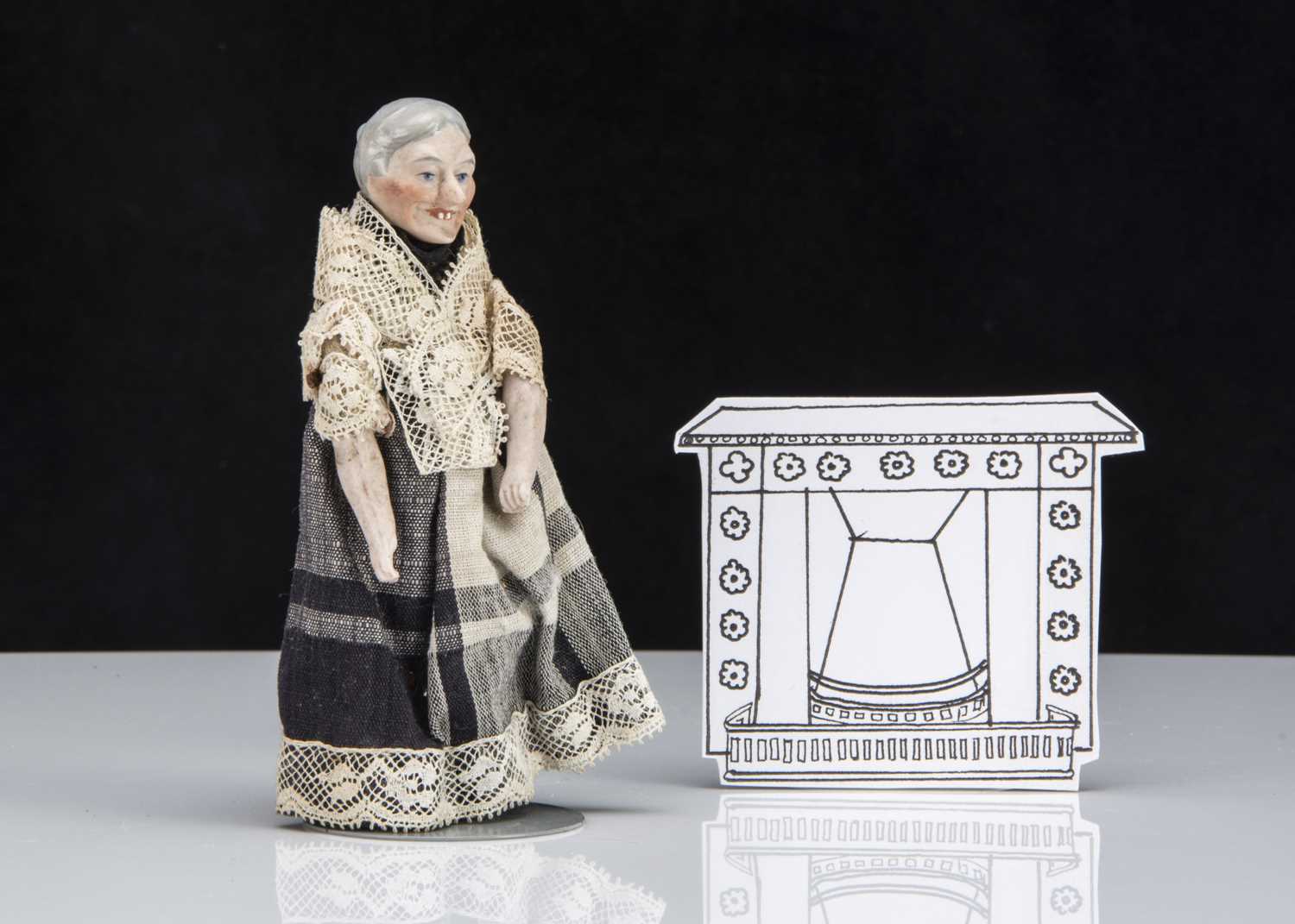 Lot 129 - An unusual German bisque shoulder-head old lady dolls’ house doll