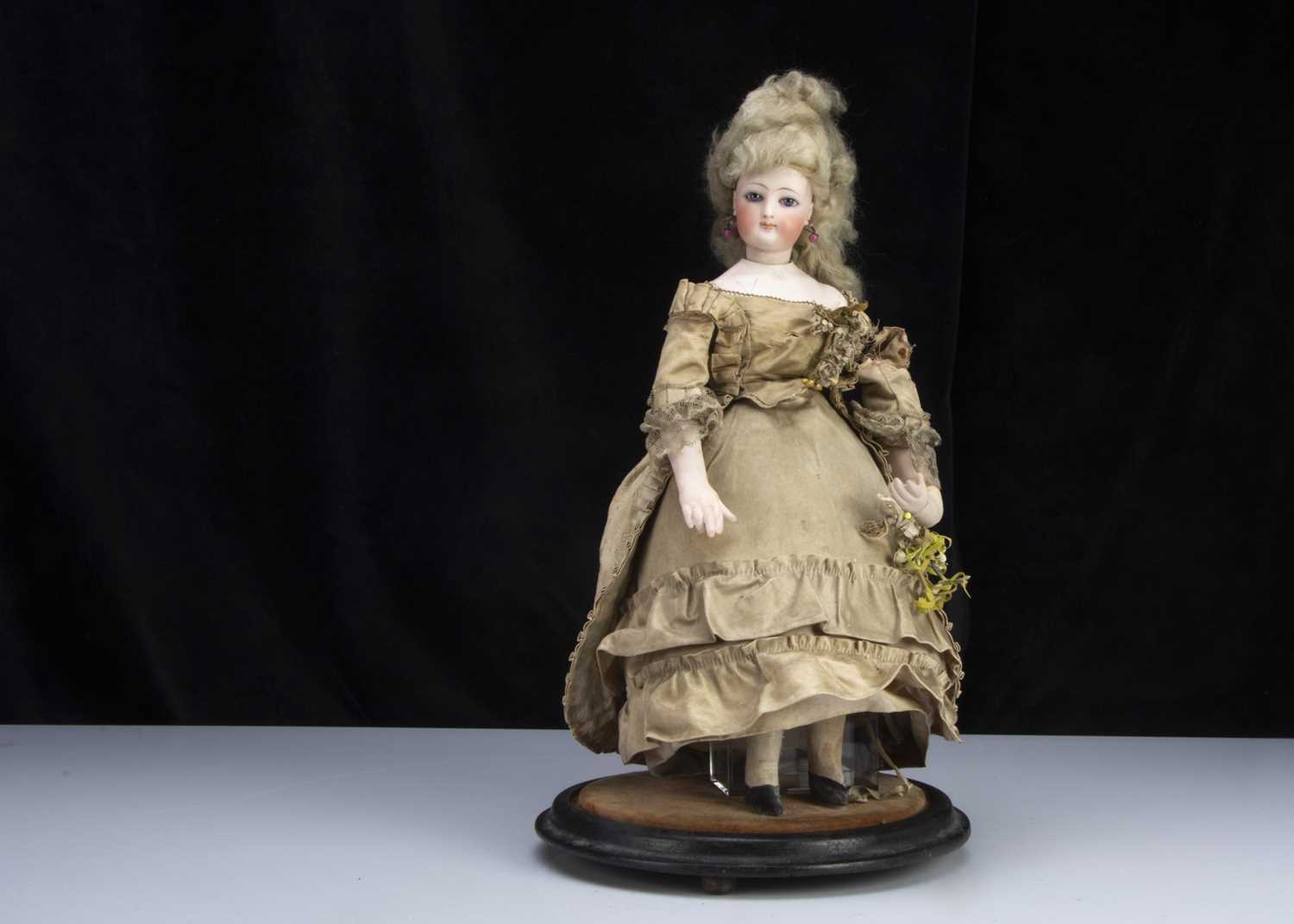 Lot 147 - A rare 19th century French pressed bisque swivel head fashionable doll bonbonniere