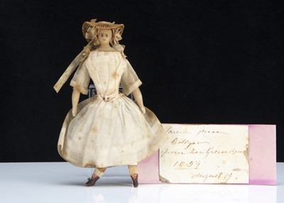 Lot 156 - A rare 19th century beeswax dolls’ house doll with provenance