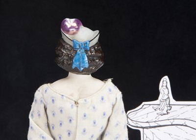 Lot 167 - A rare small 19th century German bisque shoulder-head doll with moulded hat