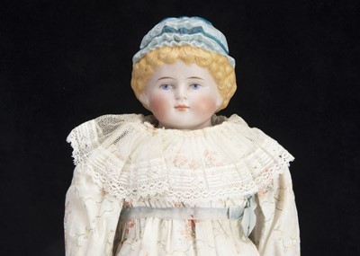 Lot 169 - A German 1054 bisque shoulder head doll with moulded hat