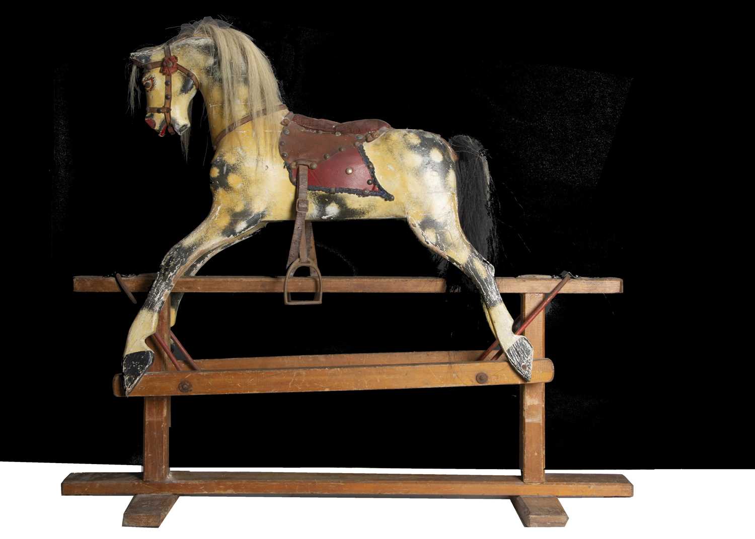 Lot 181 - A small early 20th century English carved and painted wooden rocking horse