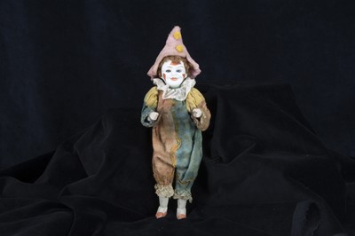 Lot 221 - A German bisque 131 white faced clown squeaker cymbal player