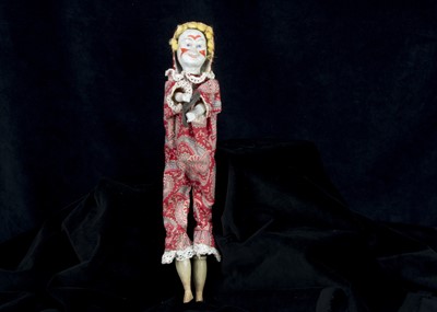 Lot 222 - An unusual German composition two-faced clown whistle toy