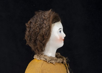 Lot 250 - An early German pink tinted china wigged shoulder-head doll