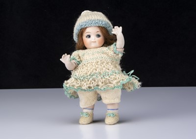 Lot 257 - A small Kestner all-bisque 111 googly eyed doll