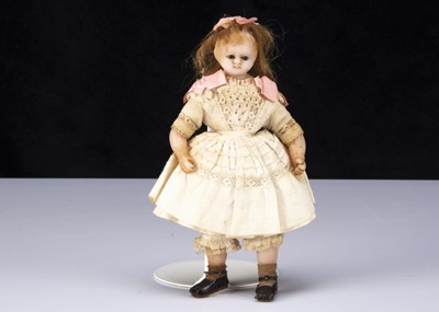 Lot 264 - A rare small English poured wax shoulder head doll
