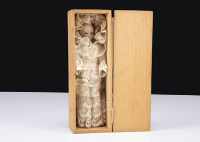 Lot 271 - A small German wax shoulder headed baby doll in wooden box
