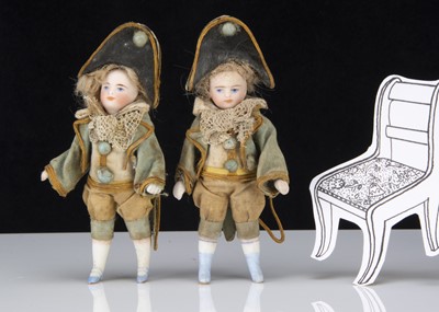 Lot 294 - A pair of all bisque Simon & Halbig dolls’ house child dolls in 18th century style costume