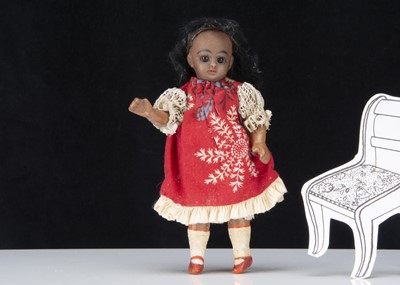 Lot 303 - A German bisque headed black dolls’ house doll