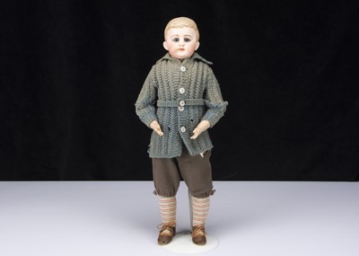 Lot 340 - A German bisque shoulder head boy doll with glass eyes and moulded hair