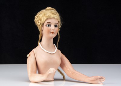 Lot 359 - A German bisque half doll with wig and jointed arms