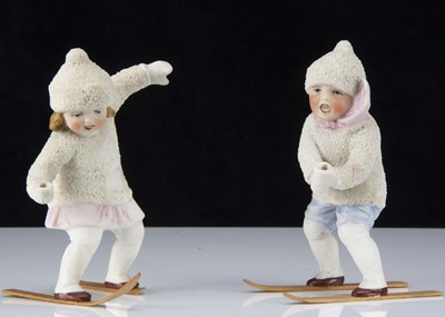 Lot 367 - A rare pair of bisque ‘Snow Baby’ skiing children