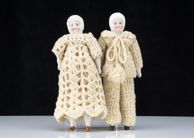 Lot 369 - A pair of bisque Snow Baby shoulder-head dolls