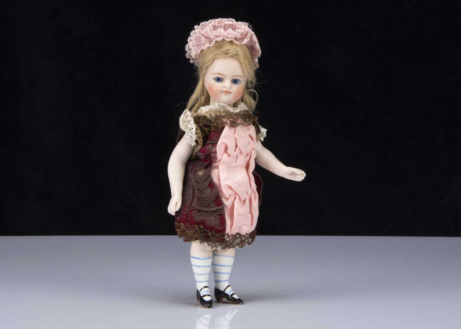 Lot 377 - A larger all-bisque Gebruder Kuhnlenz Mignonette type doll