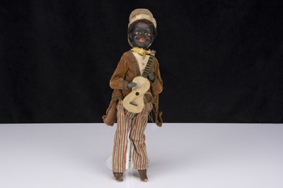 Lot 378 - A rare bisque headed black minstrel squeak toy