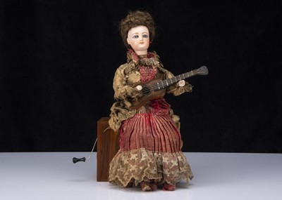 Lot 383 - An automaton girl guitar player seated on a Reuge music box