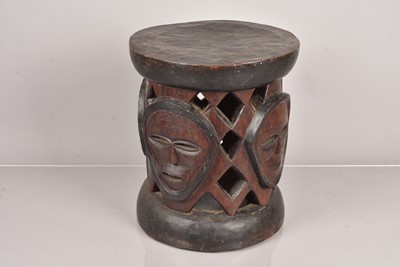 Lot 277 - A carved African Stool