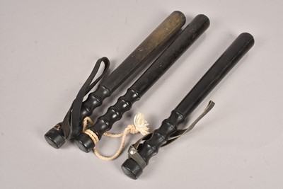 Lot 323 - Three Rubber truncheons