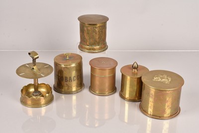 Lot 518 - A group of five trench art tobacco jars