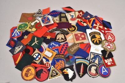 Lot 618 - An assortment of Overseas Cloth badges