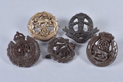 Lot 634 - Three WWII Plastic Economy cap badges