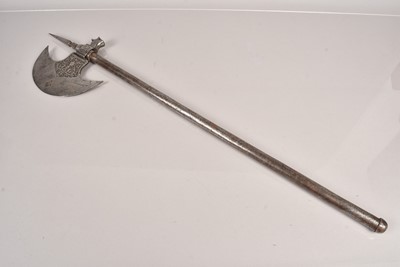 Lot 692 - A Persian Qajar engraved steel axe