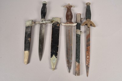 Lot 702 - Three Reproduction German daggers